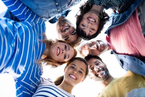 Preview: Smiling Creative Business Team Forming A Hurdle Outside