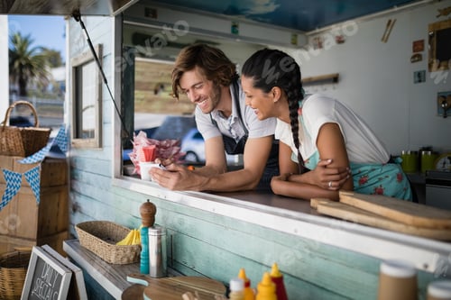 Preview: Waiter And Waitress Interacting With Each Other At Counter