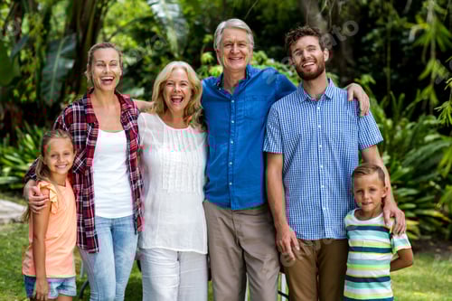 Preview: Portrait Of Happy Family Standing In Yard