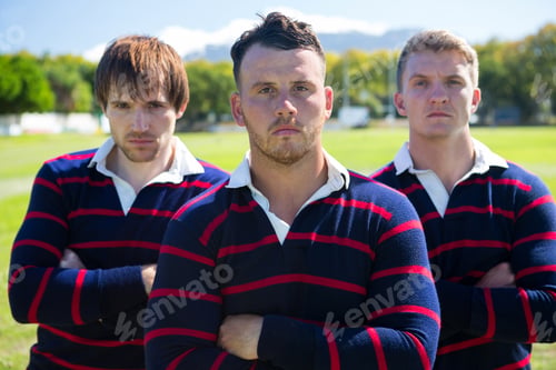Preview: Portrait Of Players With Arms Crossed Standing At Field On Sunny Day