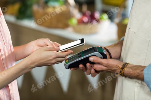 Preview: Close-Up Of Woman Making A Payment By Using Nfc Technology