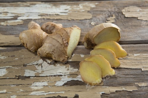 Preview: Close Up Of Fresh Chopped Gingers On Weathered Wooden Table