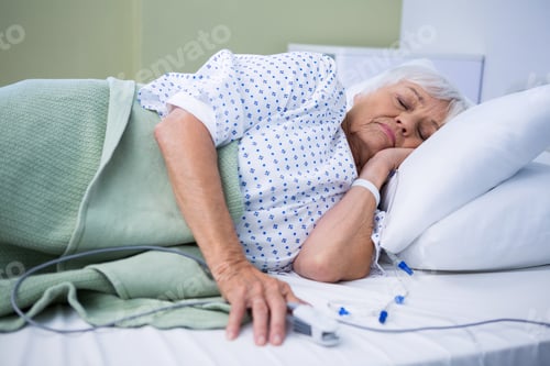 Preview: Senior Patient Lying On Bed In Hospital