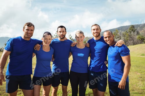 Preview: Group Of People Standing With Arms Around Each Other During Boot Camp Training In Boot Camp