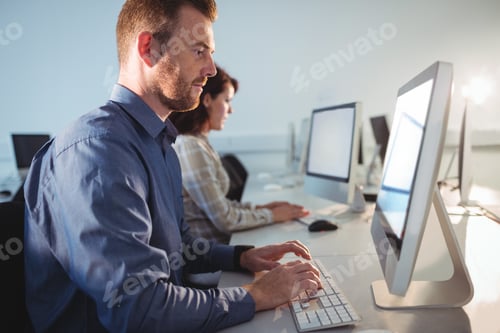 Preview: Mature Student Using Computer In The Computer Room At College