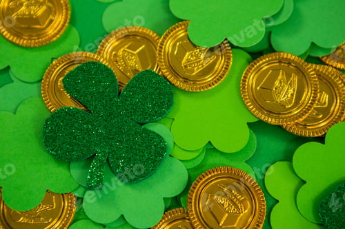 Preview: St Patricks Day Shamrocks And Gold Chocolate Coin On Green Background