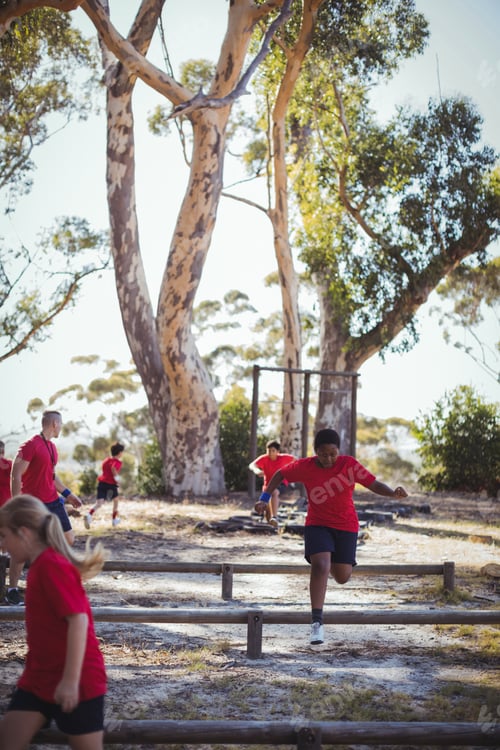 Preview: Trainer Instructing Kids During Obstacle Course Training In The Boot Camp