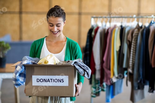 Preview: Young Woman With Donation Box In The Office