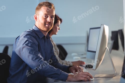 Preview: Portrait Of Mature Student Using Computer In The Computer Room At College