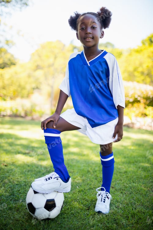 Preview: Portrait Of Girl Standing With Soccer Balloon In Park