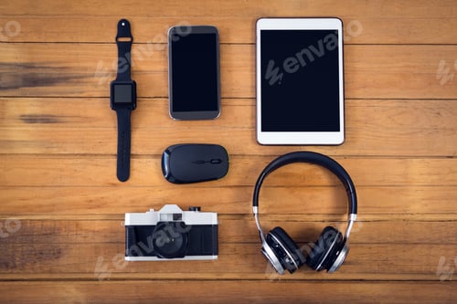Preview: Overhead View Of Technologies On Wooden Table In Office