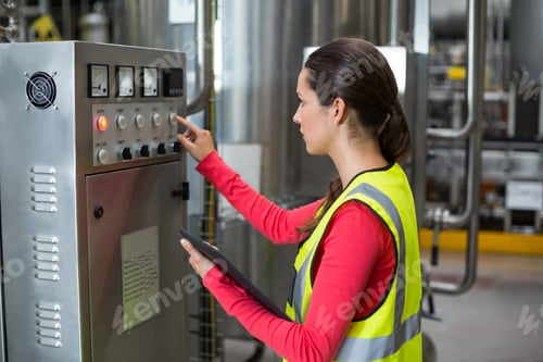 Preview: Female Factory Worker Operating Machine In Bottle Factory