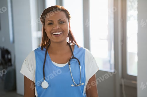 Preview: Portrait Of Smiling Doctor Standing In The Hospital