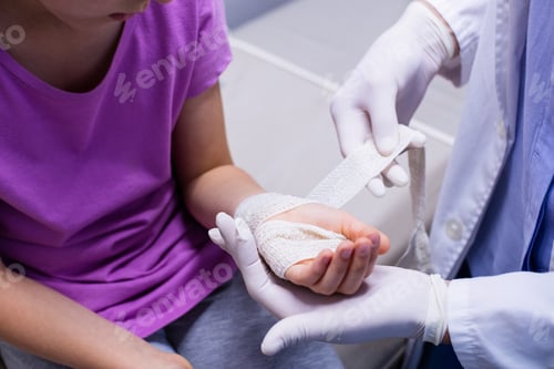 Preview: Doctor Putting Bandage On Injured Hand Of Patient In Hospital