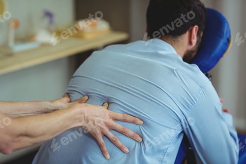 Preview: Physiotherapist Giving Back Massage To A Patient In The Clinic