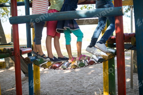 Preview: Low Section Of Children Walking On Jungle Gym At Play Ground