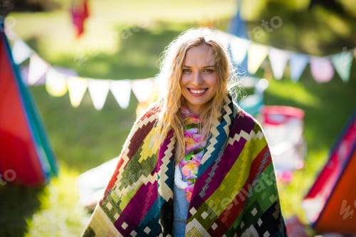 Preview: Portrait Of Woman Wrapped In Blanket In Park On A Sunny Day