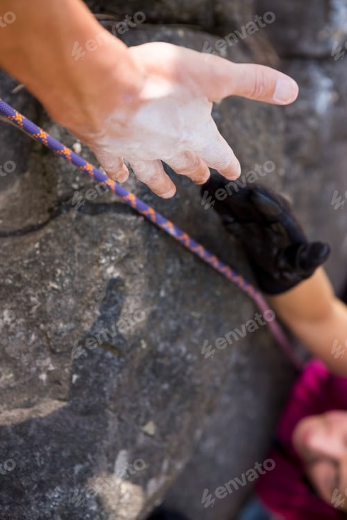 Preview: Close Up Man Helping Woman In Rock Climbing