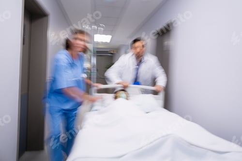 Preview: Doctors Pushing Emergency Stretcher Bed In Corridor At Hospital, Healthcare Workers In The