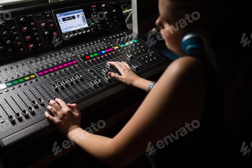 Preview: Female Audio Engineer Using Sound Mixer In Recording Studio