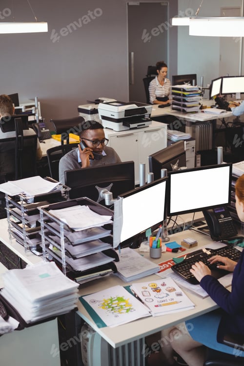 Preview: High Angle View Of Coworkers Working At Their Desk In Office