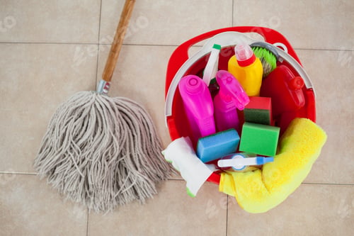Preview: Close-Up Of Bucket With Cleaning Supplies And Mop On Tile Floor