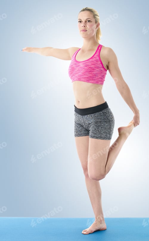 Preview: Young Woman Doing Full Body Yoga Exercise On Blue Mat