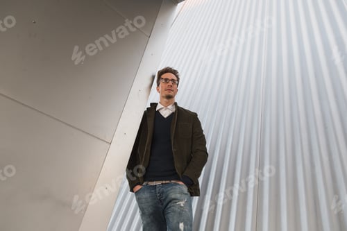Preview: Young Handsome Man With Short Hair Posing In An Urban Context