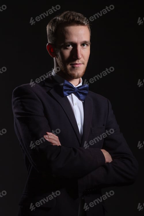 Preview: Portrait Of A Young Successful Man On A Dark Background.