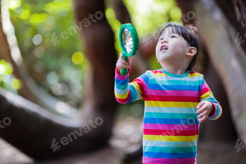 Preview: Young Girl Holding A Magnifier And Looking Up In The Summer Forest Morning