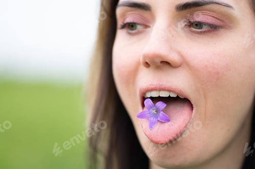 Preview: Girl Holding A Flower In Her Mouth
