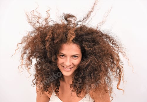 Preview: Pretty Young Woman Blowing Her Hair With Hair Blower. Healthy Long Curly Hair. Beauty Fashion