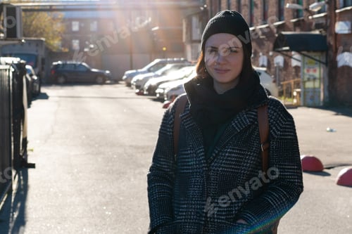 Preview: Girl Standing In A Coat On The Street In The City