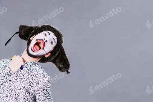Preview: Mime Posing Against A Gray Wall Background