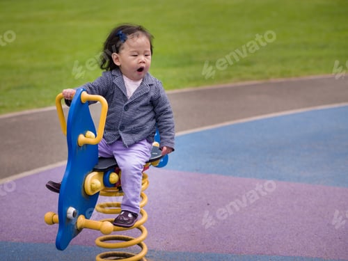 Preview: Tied Baby Girl On Rocking Horse