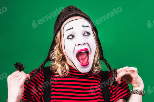 Preview: Cheerful Mime Girl Posing And Grimacing In Photo Studio