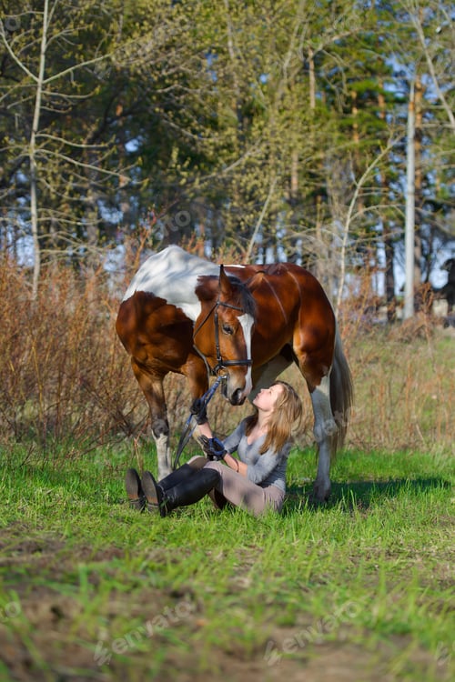 Preview: Girl Sportswoman And Her Horse After A Riding In The Spring
