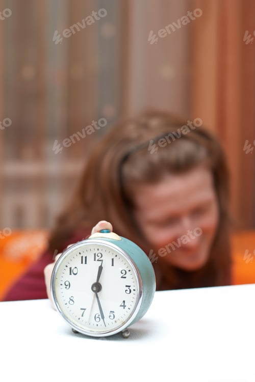 Preview: Alarm Clock Disturbing A Sleeping Woman That Is Defocused