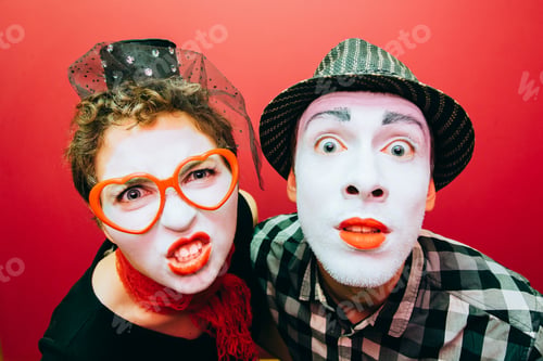 Preview: Two Mimes Showing Emotions On The Wall Background