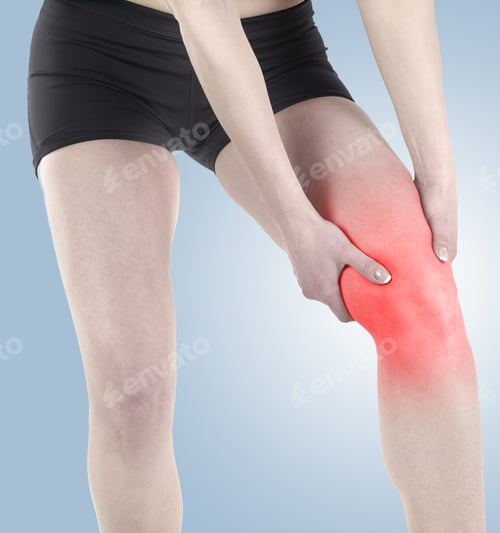 Preview: Acute Pain In A Knee. Woman Holding Hand To Spot Of Knee-Aches.