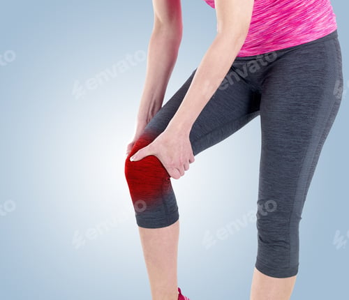 Preview: Acute Pain In A Knee. Woman Holding Hand To Spot Of Knee-Aches.