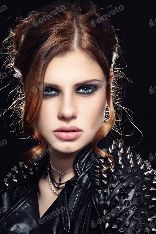 Preview: Portrait Of Young Beautiful Woman With Stylish Make-Up In Spiked Leather Jacket
