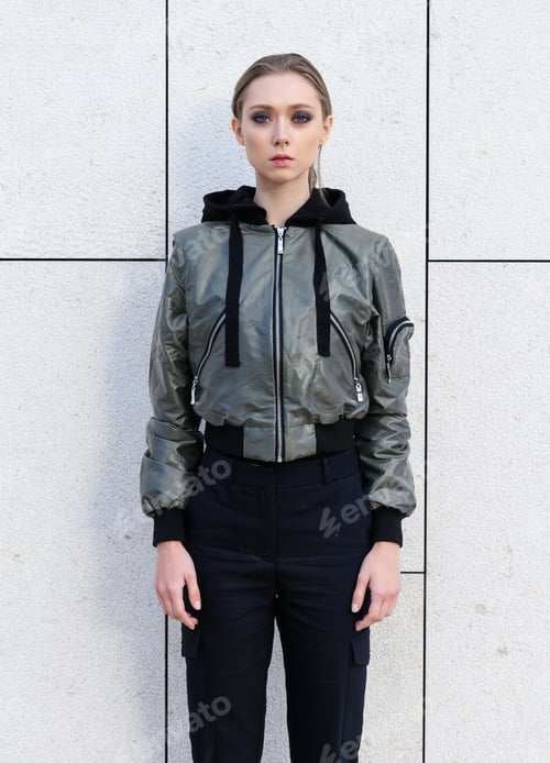 Preview: Street Style Fashion. Girl Model In Fashionable Clothes On A Background Of A Gray Wall.