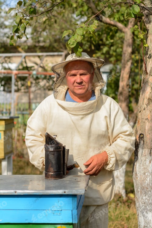 Preview: Beekeeper Hives In The Apiary Near Blows Smoker For Bees