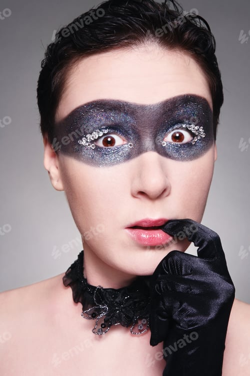 Preview: Woman Wearing Elaborate Eye Makeup and Black Gloves