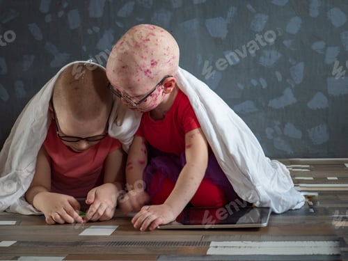 Preview: Caucasian Children In Pink T-Shirt With Smartphone On Floor. Boys Posing For Camera Under White