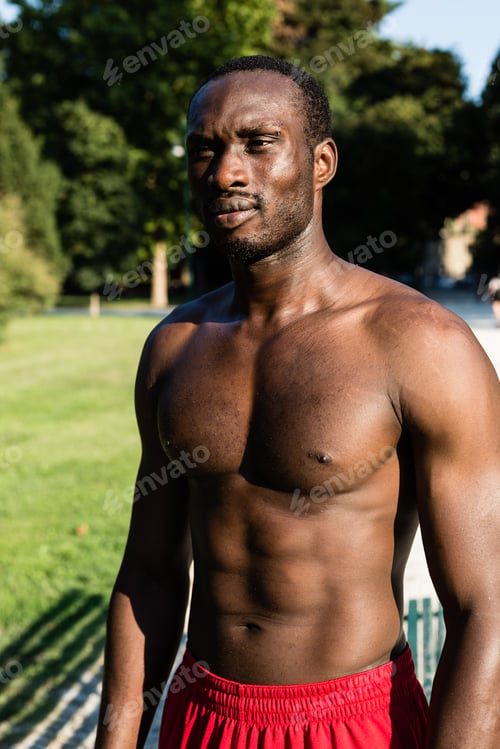 Preview: Athletic Black Man Posing In A City Park. Concept Of Healthy Lifestyle.