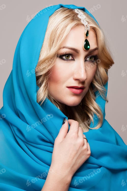 Preview: Portrait Of A Beautiful Young Woman In Blue Fabric