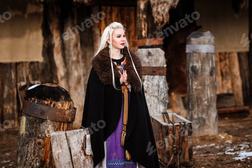 Preview: Beautiful Young Woman Holding A Viking With Blond Hair. Image Of Historical Figure