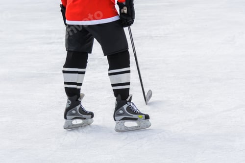 Preview: Hockey Skates Standing On Ice With Hockey Stick